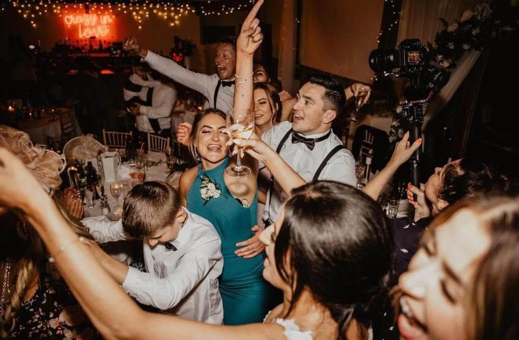 Singing Waiters perform at a party