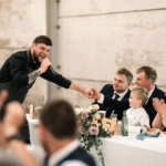 singing waiter surprising guests