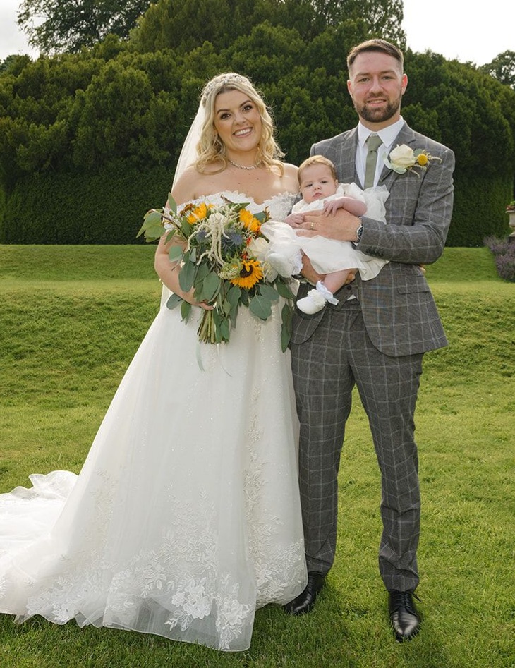 Newly weds with their baby