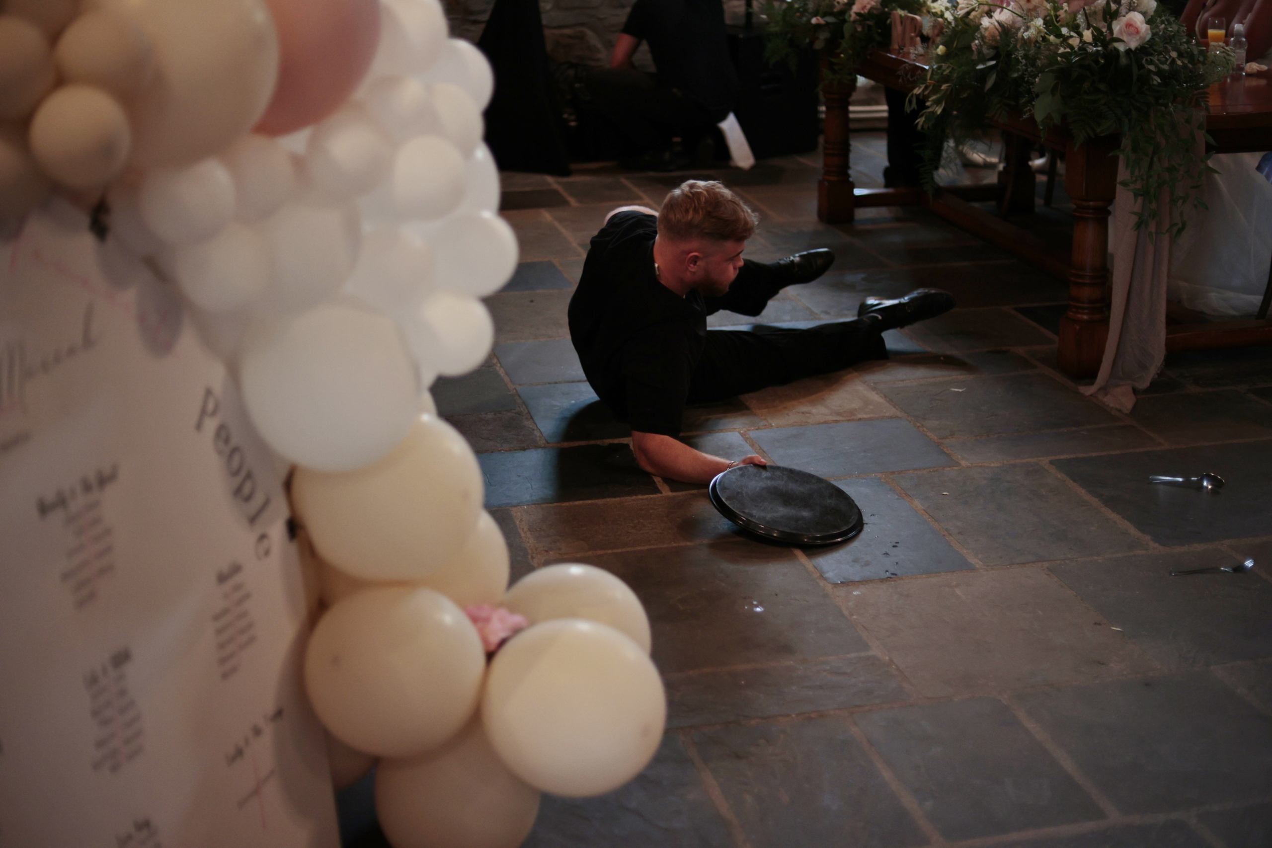 A Singing Waiter falling ahead of his performance.
