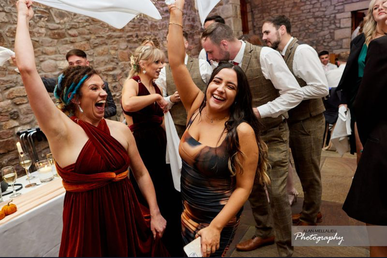 Guests enjoying the party with our singing waiters