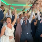 Bride enjoying Silver Service Singers Singing Waiters on her Wedding Day