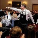 Singing Waiter interacting with guests