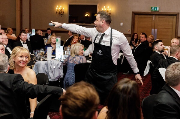 Singing Waiter interacting with guests