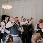 Groomsmen get into the party spirit with Silver Service Singers