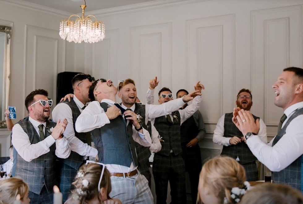 Groomsmen get into the party spirit with Silver Service Singers