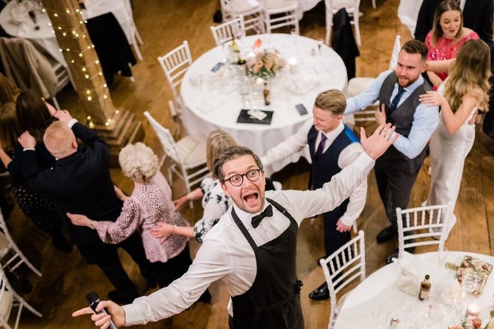 Silver Service Singing Waiter Leads the Conga Line