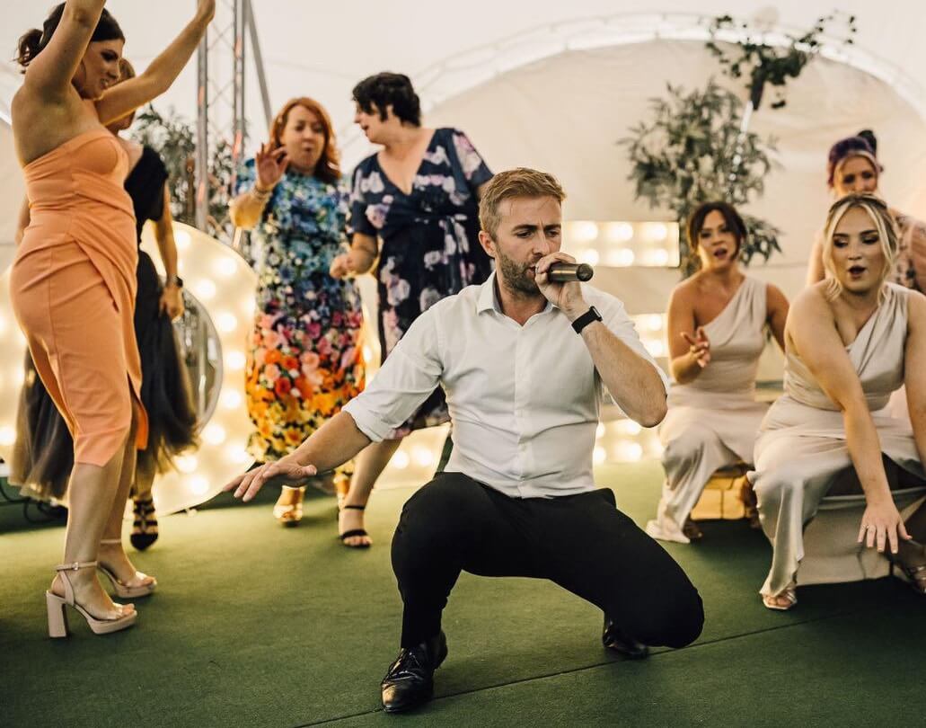 Silver Service Singing Waiter dancing and singing with bridesmaids