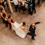 An ariel view of a conga line at a wedding - Silver Service Singers