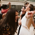 Bride and guests dancing at wedding reception