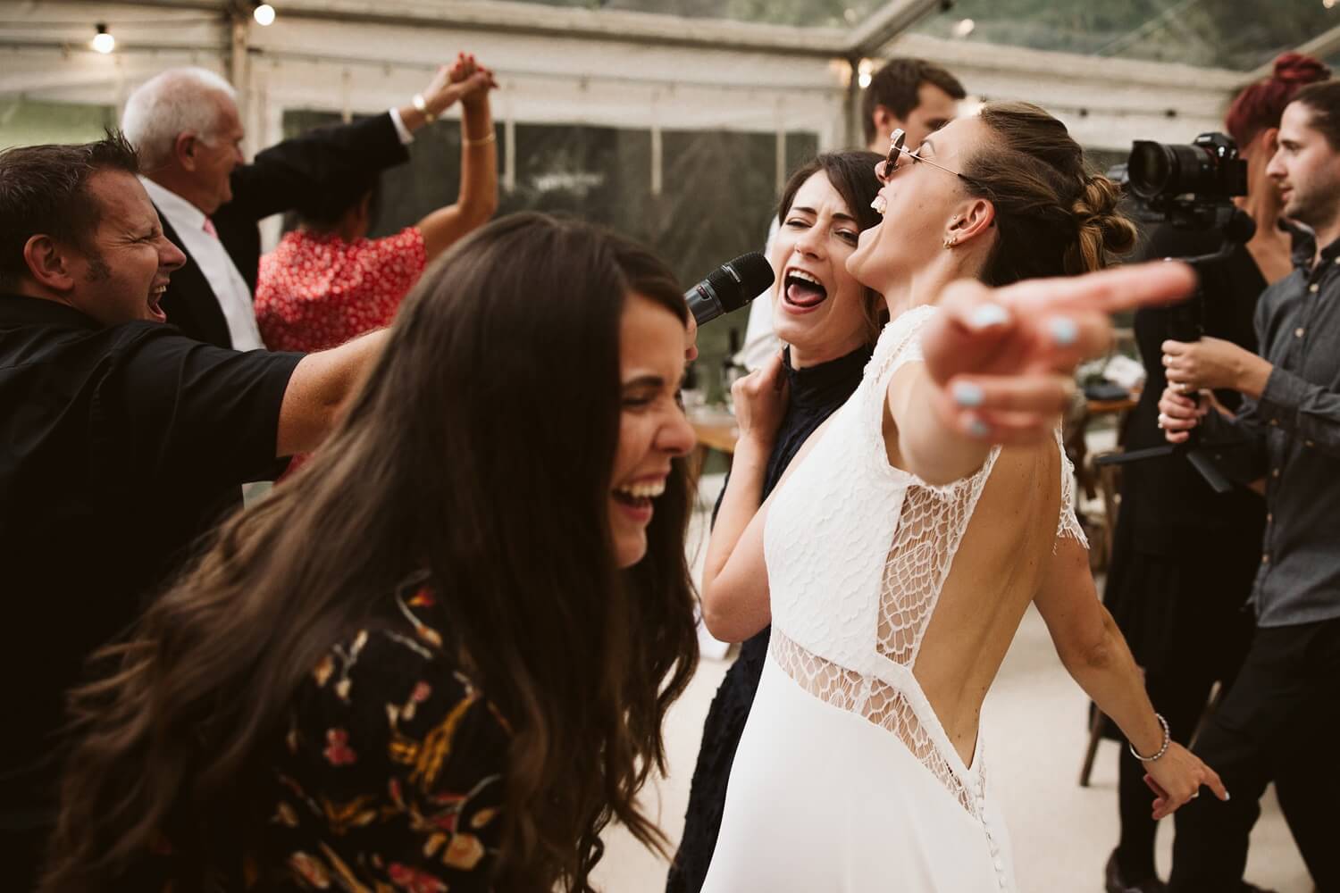 Bride and guests dancing at wedding reception