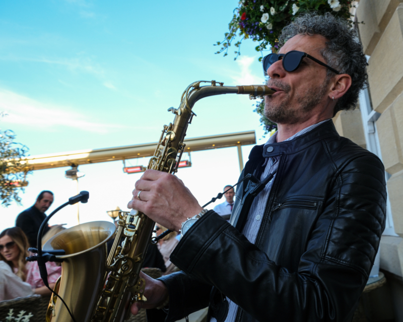 Carlo Saxophonist plays to a crowd