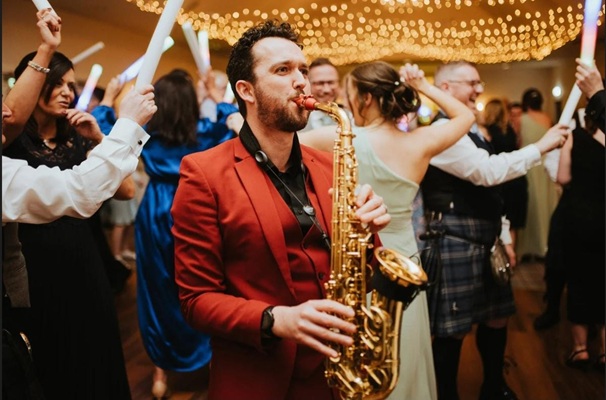 the-man-with-red-suit-sax-player-weddings