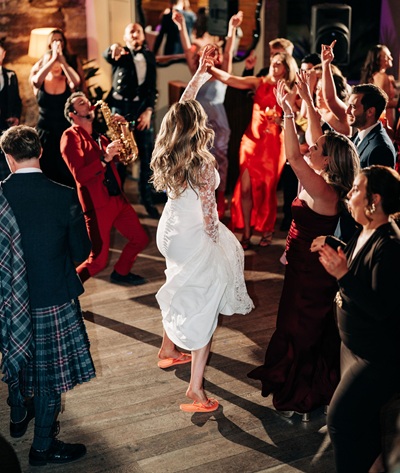 The Man with the Red Suit performing at a Wedding