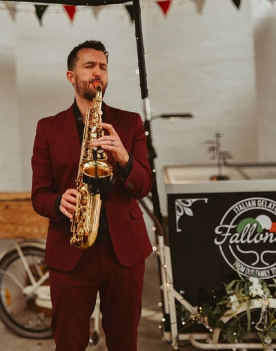 Tom B - The Man with The Red Suit Sax player