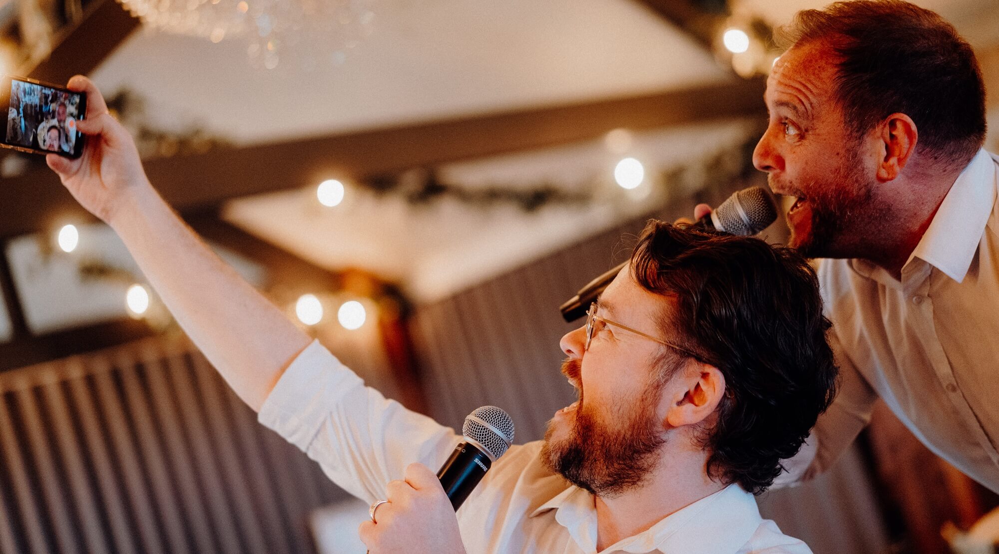 Singing Waiters taking a selfie as they perform - Silver Service Singers