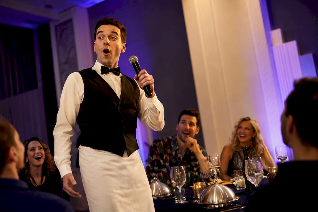Singing waiter surprising 90s party guests