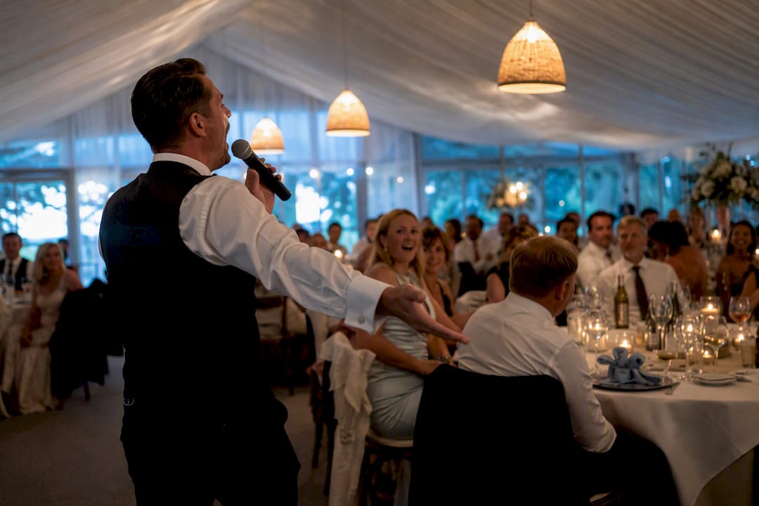 Singing waiter surprising wedding breakfast guests