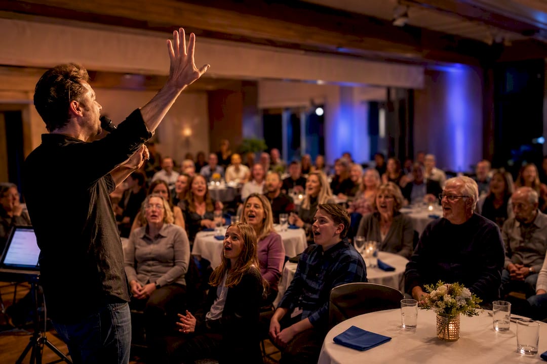 Audience joining an interactive singalong