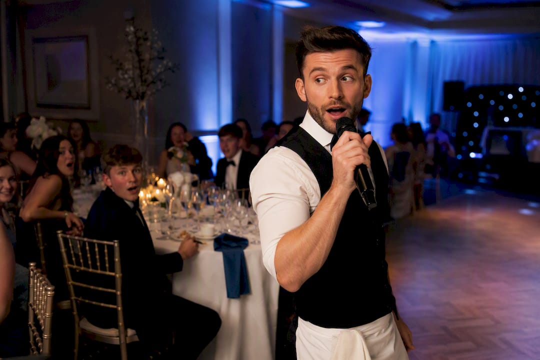 Singing waiter surprising school prom guests