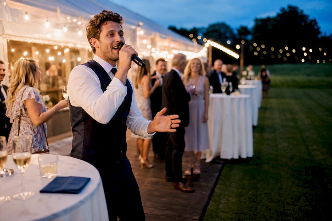 Singer performing at outdoor garden wedding
