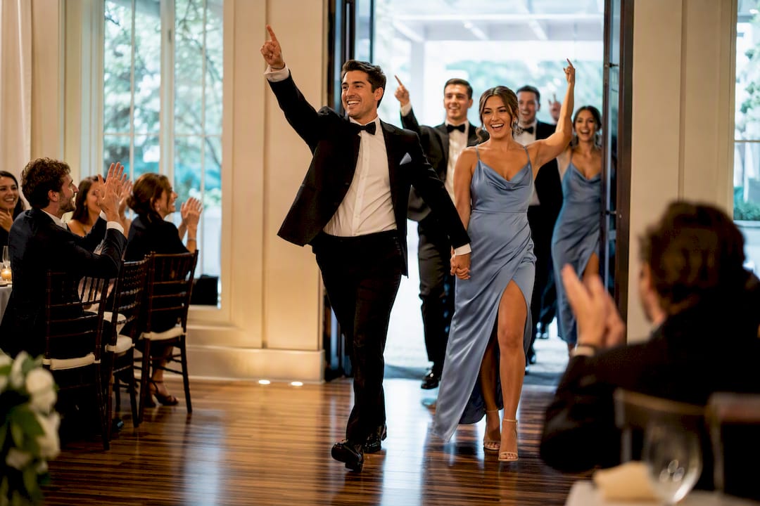 Bridal party entering wedding reception
