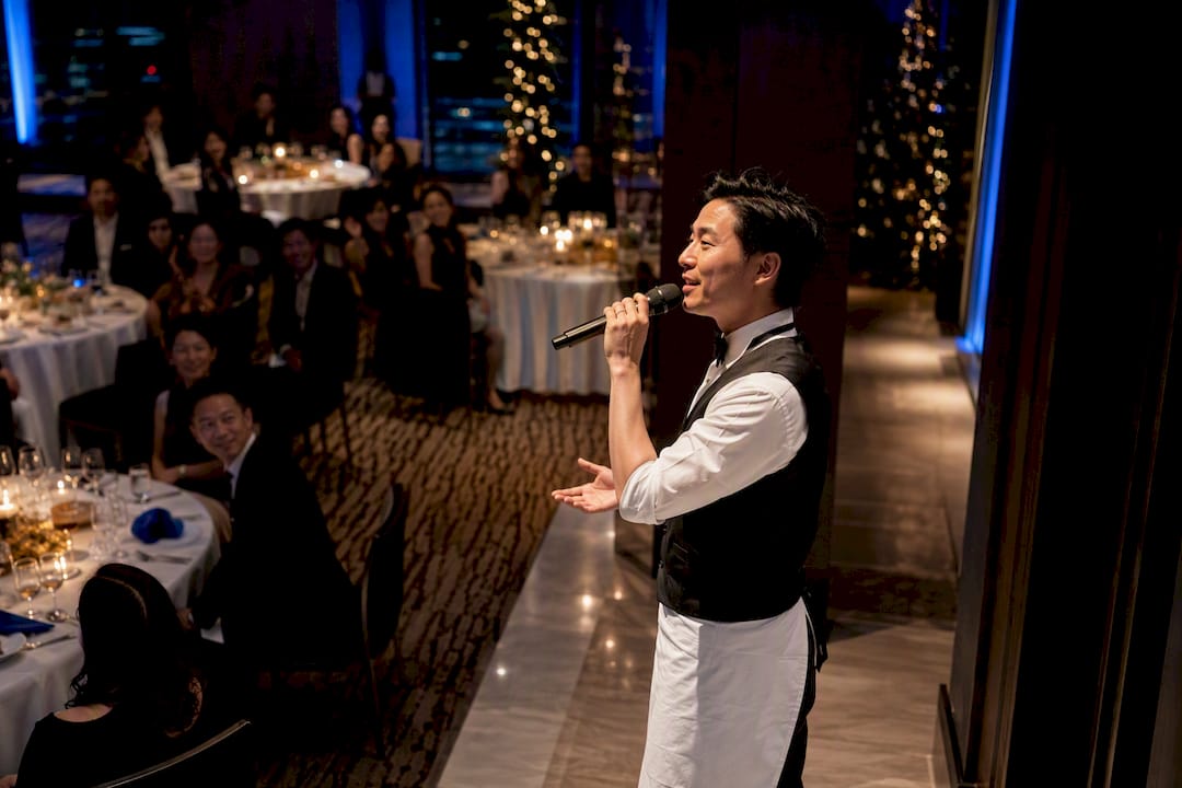 Singing waiter surprising New Year's Eve guests