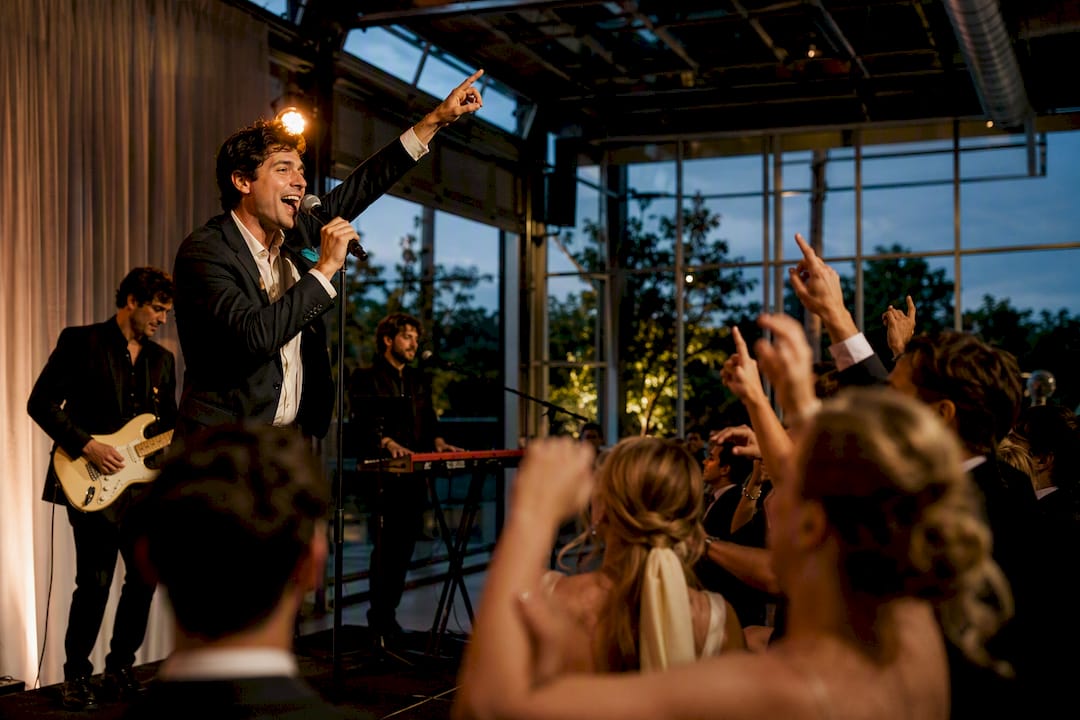Vocalist leading an 80s wedding sing-along