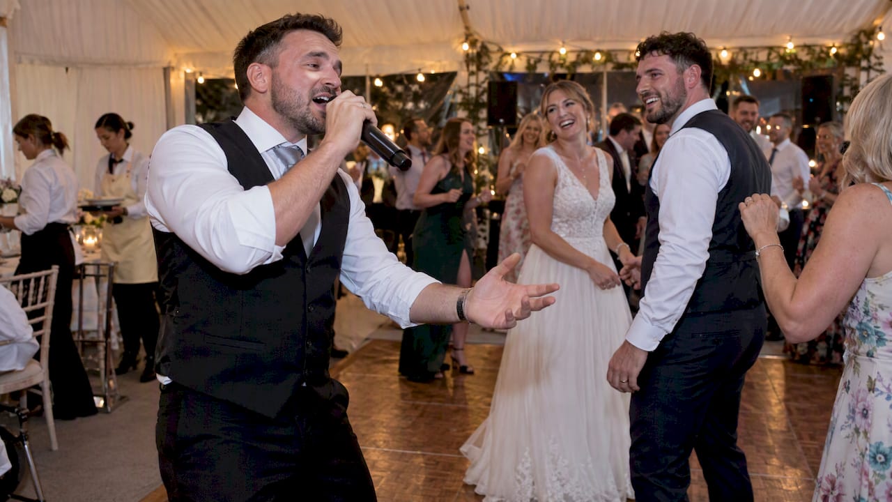 Singing waiter performing wedding final song