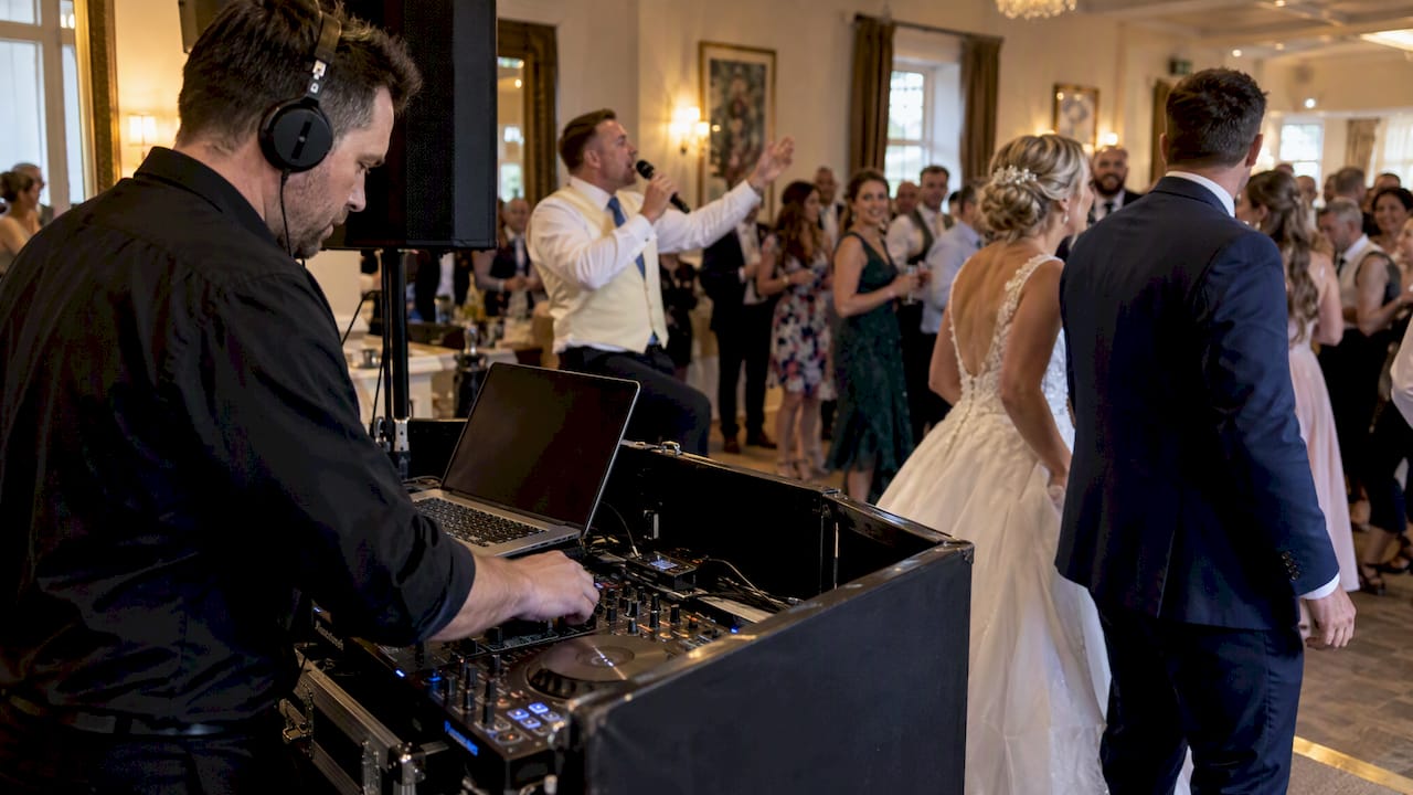 Wedding DJ cueing garter toss music