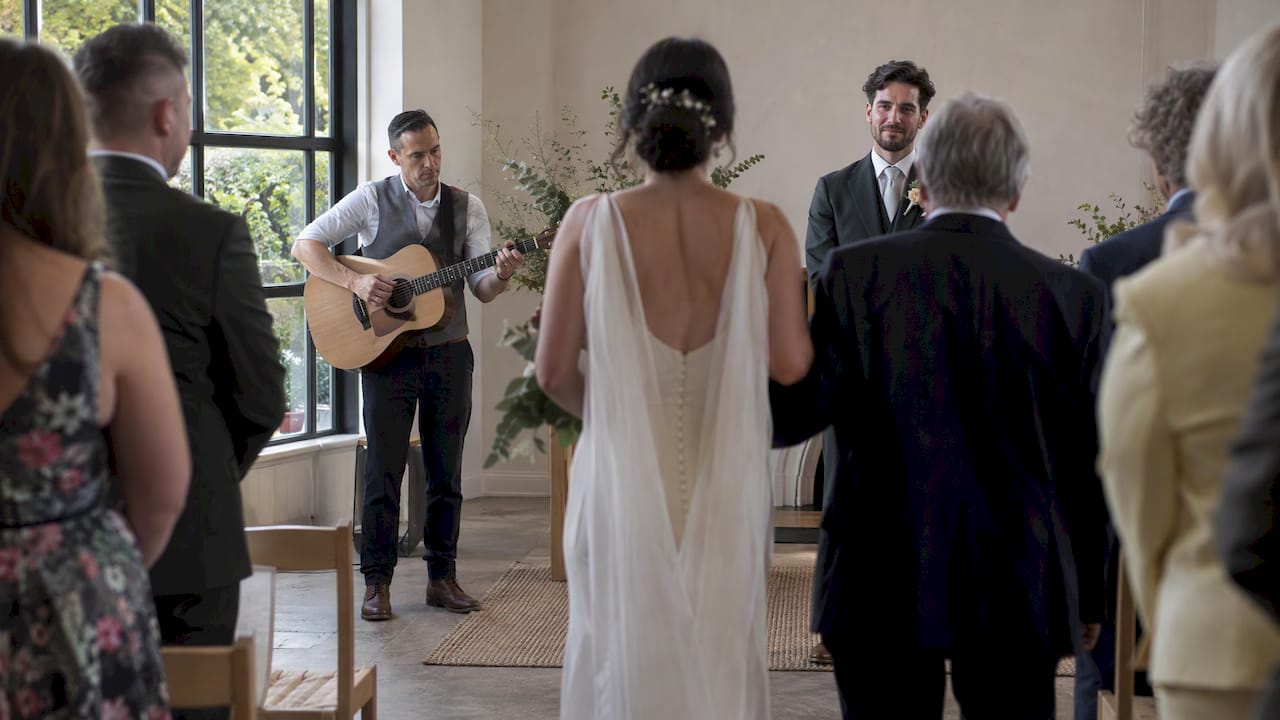 Acoustic singer performs during a wedding entrance