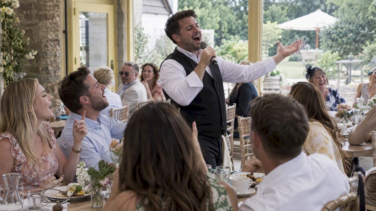 Guests joining a singer at wedding brunch