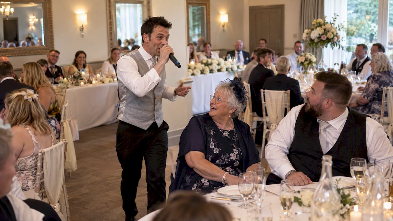 Singing waiter surprises guests at a wedding