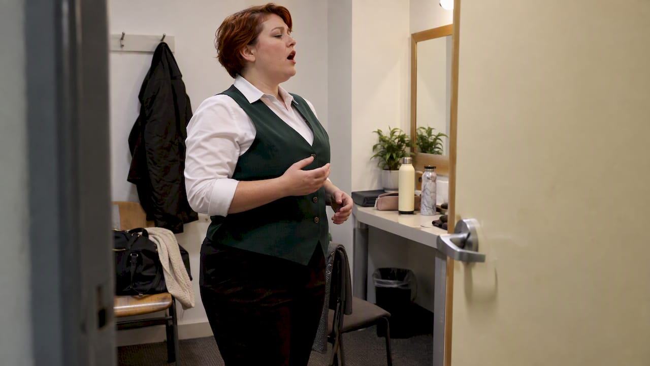 Singer warming up in a private venue room